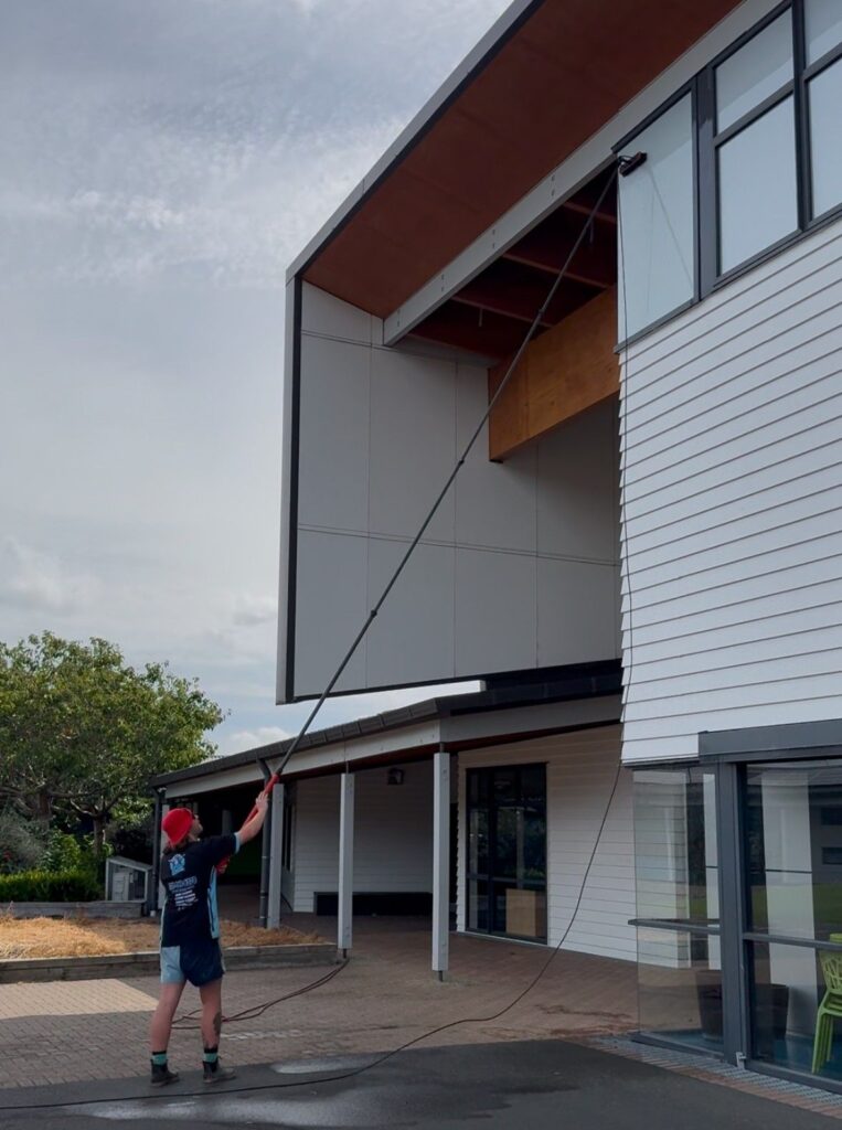 cleaning the exterior of a tall building in east auckland