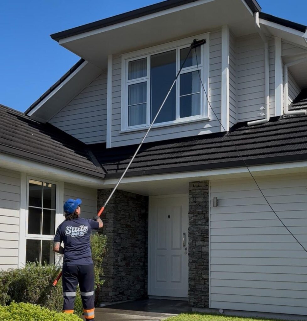 Expert team performing professional house washing in Auckland